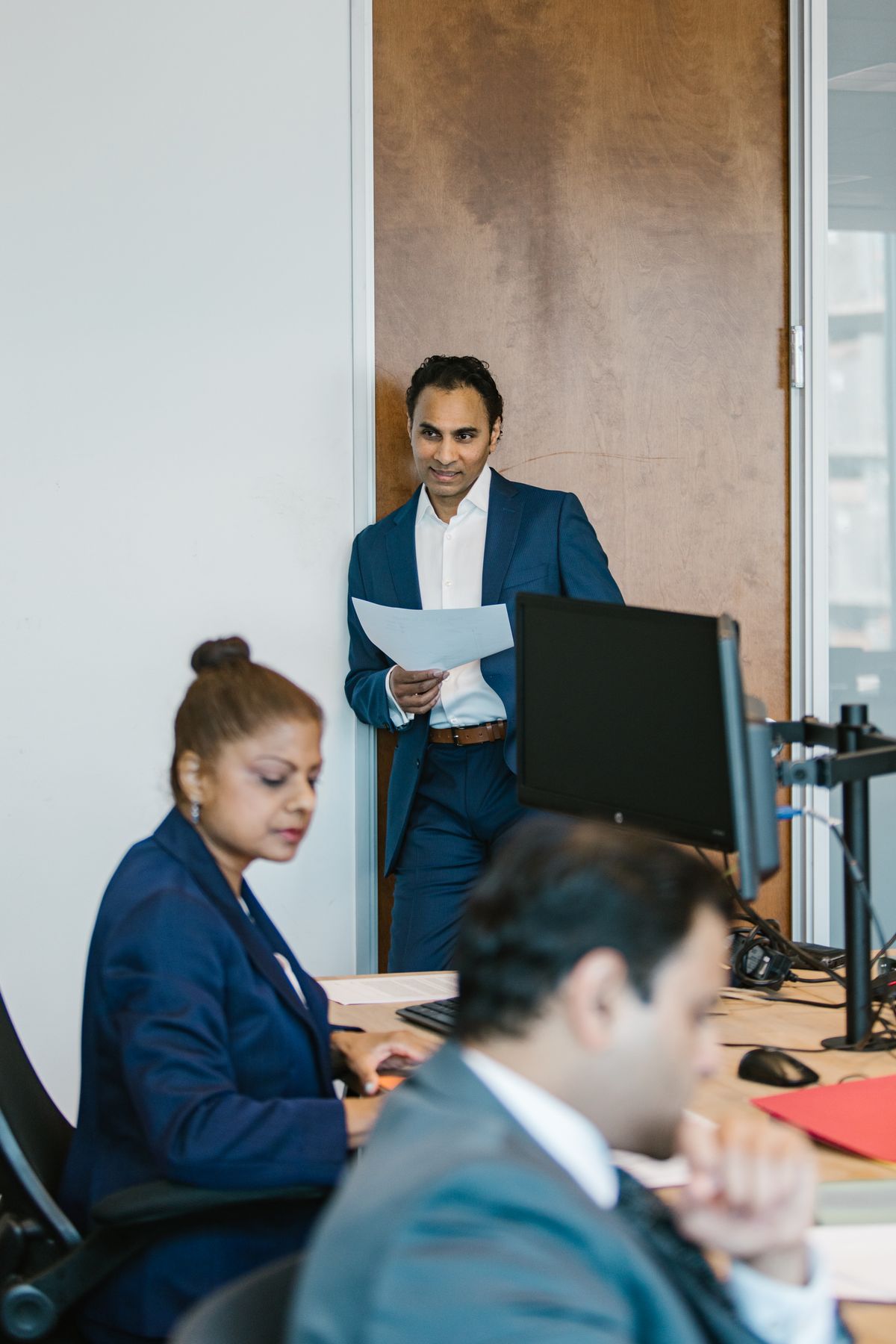 Pakistani professionals at work in a modern office